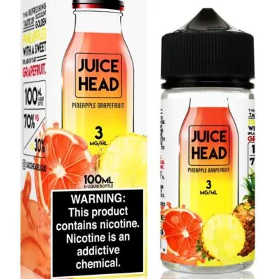 Juice Head Pineapple Grapefruit e-liquid bottle and packaging with nicotine warning label.