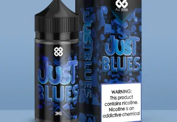 E-liquid bottle and box labeled "Just Blues" with a nicotine warning on a blue background.